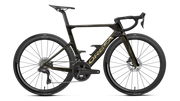 A high-end Orbea performance road bicycle in matte black with gold accents, featuring deep drop handlebars, carbon fiber wheels, and a sleek carbon frame, shown against a solid white background.