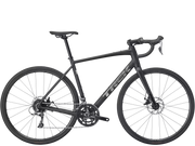 A dark gray Trek road endurance bicycle with drop handlebars, disc brakes, and a carbon fiber frame, shown from a side profile on a white background.