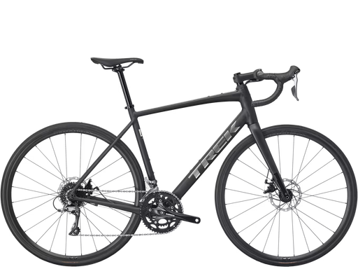 A dark gray Trek road endurance bicycle with drop handlebars, disc brakes, and a carbon fiber frame, shown from a side profile on a white background.