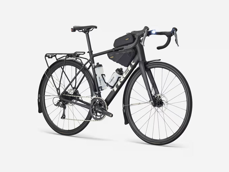 Black endurance road bicycle with gear packs on a white background