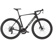 A black Trek road endurance racing bicycle with drop handlebars, deep carbon fiber wheels, and the Trek logo in white on the frame, shown against a solid white background.