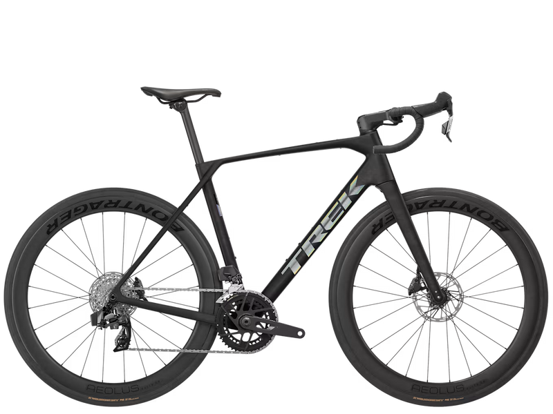 A black Trek road endurance racing bicycle with drop handlebars, deep carbon fiber wheels, and the Trek logo in white on the frame, shown against a solid white background.