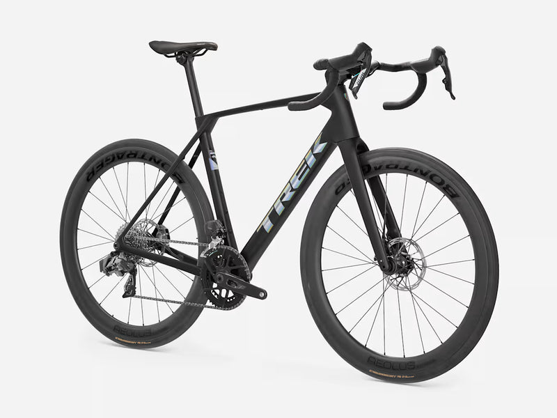 A black Trek road endurance bicycle with drop handlebars, carbon fiber wheels, and a sleek aerodynamic frame, shown from a three-quarters angle on a light gray background.