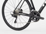 Close-up of a bicycle wheel and gear system on a white background