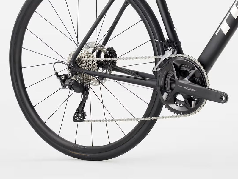 Close-up of a bicycle wheel and gear system on a white background