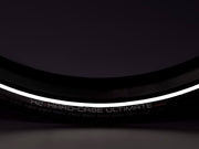 Close-up of a bicycle tire with 'H2 Hard-Case Ultimate' branding on a dark background