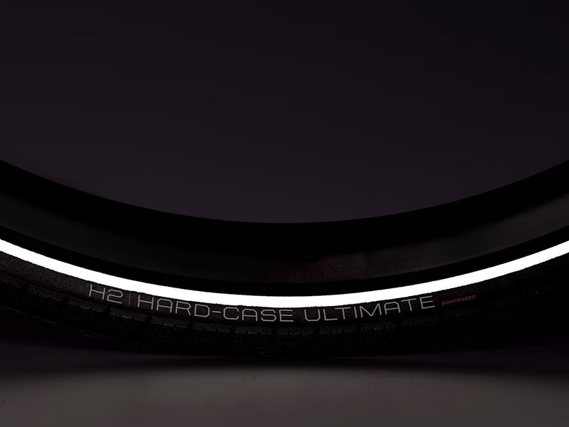 Close-up of a bicycle tire with 'H2 Hard-Case Ultimate' branding on a dark background