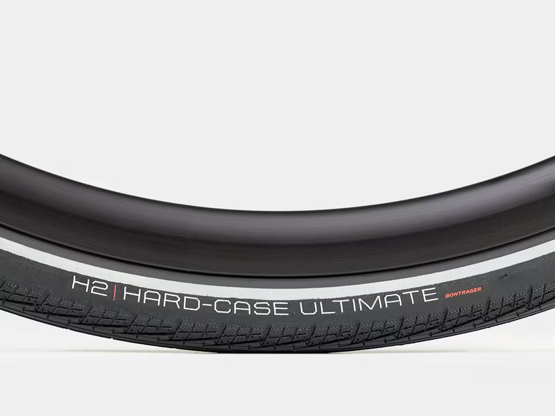 Close-up of a bicycle tire with 'H2 Hard-Case Ultimate' branding on a white background