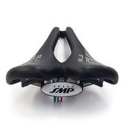 Product image of the Selle SMP Nymber Saddle in black leather with stitched SMP logo and central ergonomic cutout, back view.