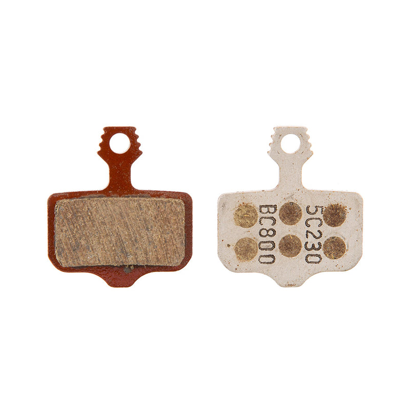 Two brake pads with visible wear on a white background