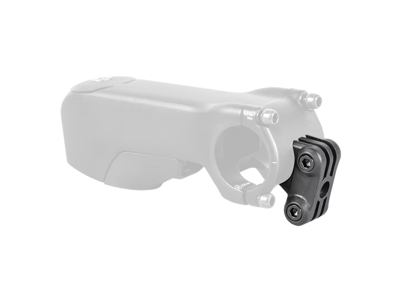 A black quick-release bicycle headset spacer or adapter mounted to a silver bicycle stem, shown against a plain white background with a faintly visible white stem overlay.