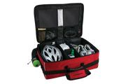 An open CAT5GEAR bicycle BAG with a red exterior, black interior lining, and various CYCLING items organized inside, including a white bicycle helmet, a green bottle, shoes, gloves, shown on a white background.