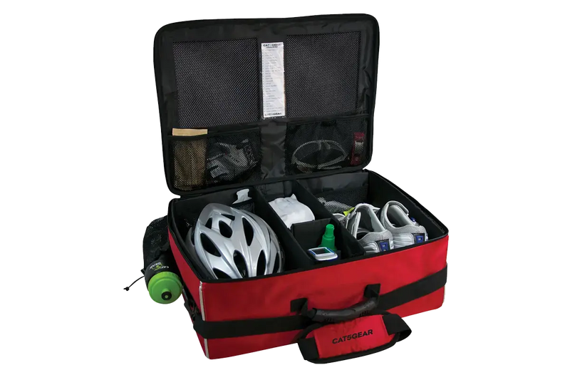 An open CAT5GEAR bicycle BAG with a red exterior, black interior lining, and various CYCLING items organized inside, including a white bicycle helmet, a green bottle, shoes, gloves, shown on a white background.