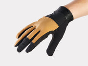 Trek Rhythm mountain bike glove back of hand view with beige suede panel, textured thumb and index fingers, and ribbed cuff