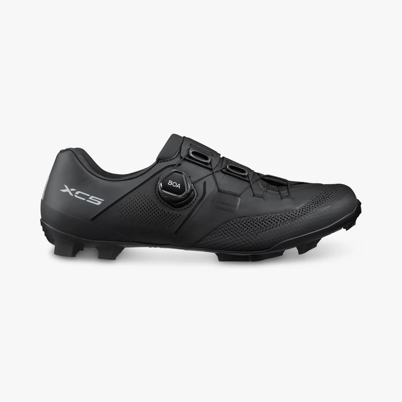 Lateral side view of black Shimano SH-XC503 cycling shoe displaying BOA L6C dial closure, perforated synthetic upper, XC5 logo, and ULTREAD outsole profile