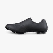 Medial side view of black Shimano SH-XC503 shoe detailing seamless surround-wrapping upper, ventilation perforations, and carbon-reinforced midsole structure