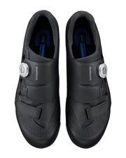 A pair of Shimano road cycling shoes in black, shown from a top-down view against a white background. Each shoe features a dial system with silver metal dials and the Shimano brand name printed on the side.