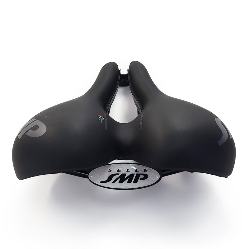 Selle SMP TRK Medium Saddle rear view with wide padded shape, central relief channel, and white SMP logo.