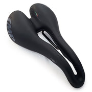 Selle SMP TRK Medium Saddle diagonal view showing thick trekking padding, ergonomic channel with embossed text, and Italy‑colour thread detail, tip positioned bottom‑right.