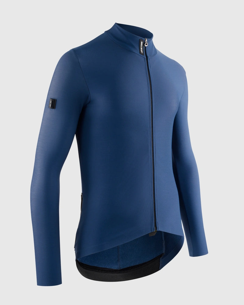 Blue cycling jacket on a light gray background, side view