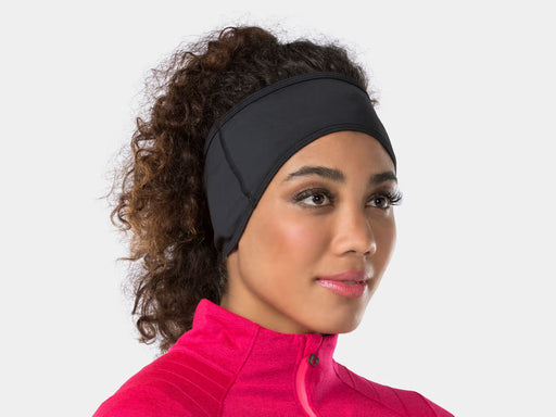 Bontrager Thermal cycling headband worn over the ears, three-quarter view with visible stitching along the top, bottom, and side