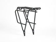 Trek BackRack Deluxe MIK Studs Rear Rack shown from a three-quarter right-side angle, featuring the aluminum cargo platform, side support rails, and integrated mounting structure.