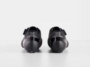 Rear view of paired black Trek Circuit Wide shoes highlighting structured heel counters, padded ankle collars, and wider rear profile