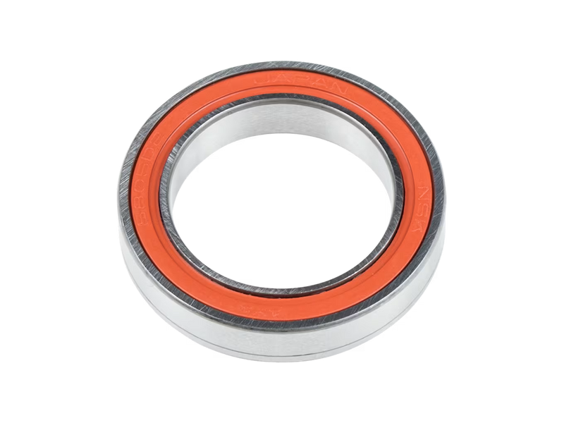 A close-up studio shot of a metal bearing with a bright orange inner ring, isolated on a white background.