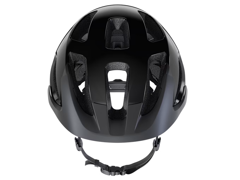 Front view close-up of the Trek Solstice Bike Helmet in Black Gloss, highlighting the large front vents, interior foam liner, and matte black visor.