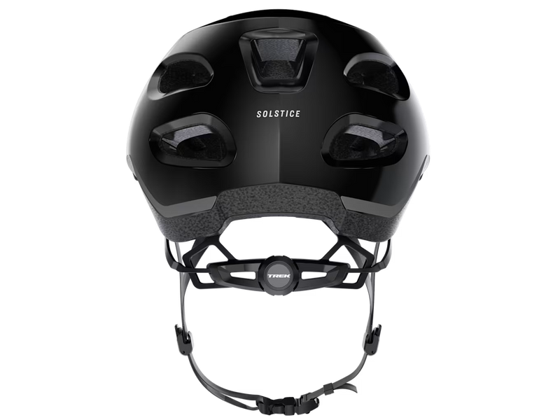 Rear view of the Trek Solstice Bike Helmet in Black Gloss, showing the Solstice branding, rear ventilation openings, and retention fit system.