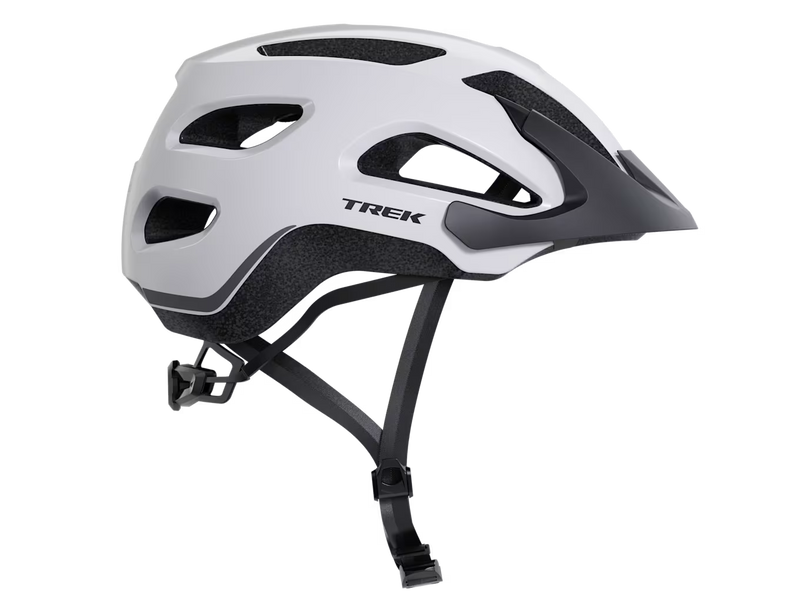 Right-side profile of the Trek Solstice Bike Helmet in Crystal White Gloss, featuring the Trek logo, matte black visor, and ventilated shell design.