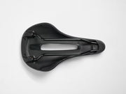 A black bicycle saddle shown from a top-down view from underneath on a clean white background.