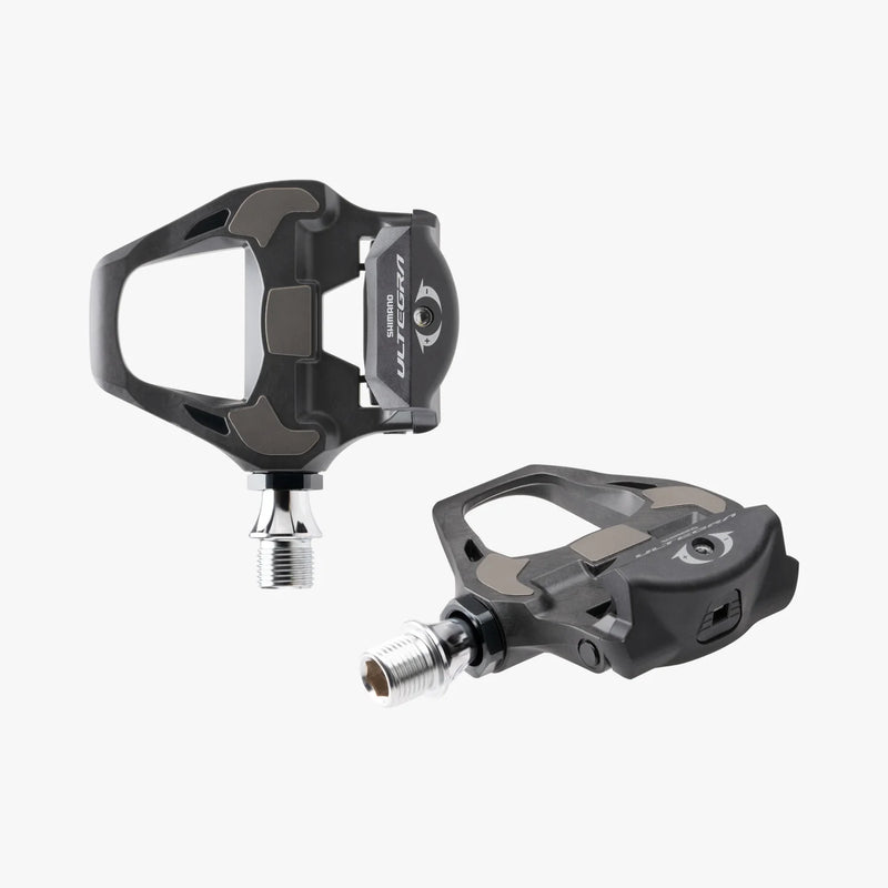 Pair of black bicycle pedals on a white background