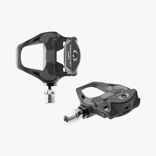 Pair of black bicycle pedals on a white background