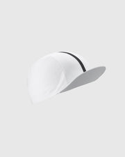 White baseball cap with a black band on a light gray background