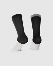 A pair of black and white athletic crew socks shown from the back on a light gray background.