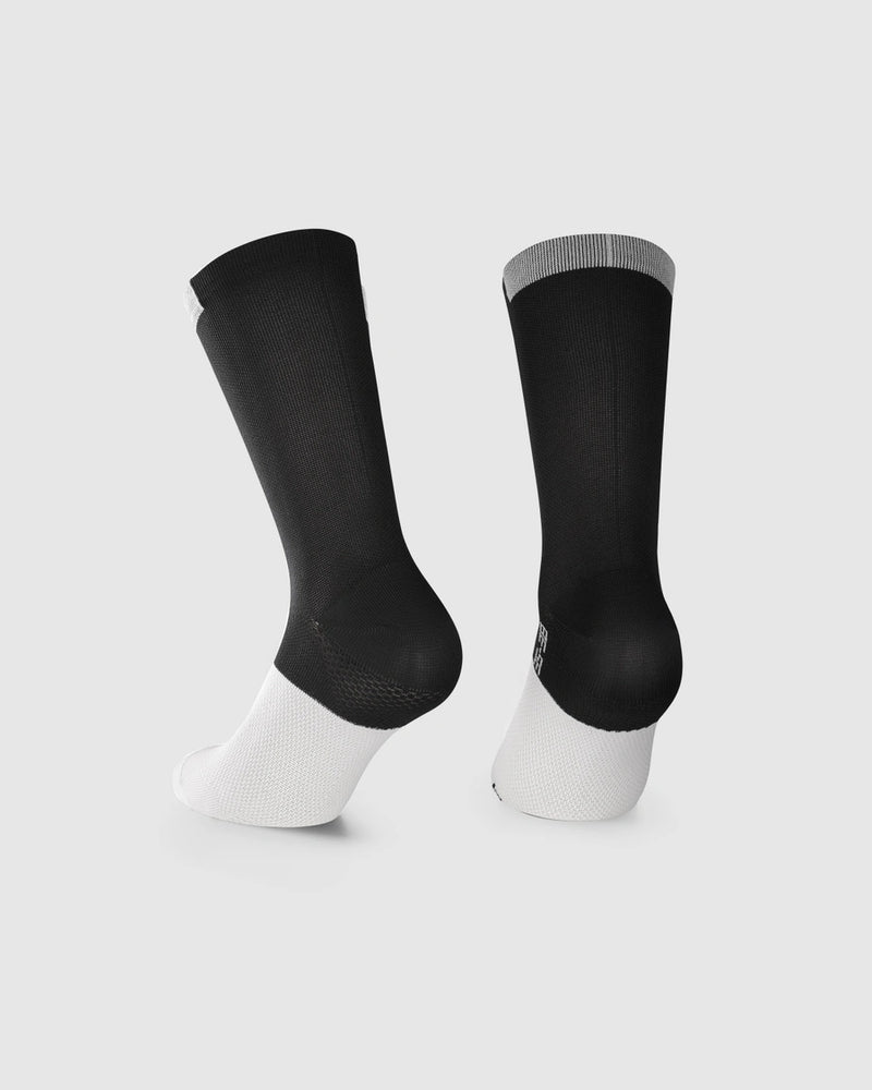 A pair of black and white athletic crew socks shown from the back on a light gray background.