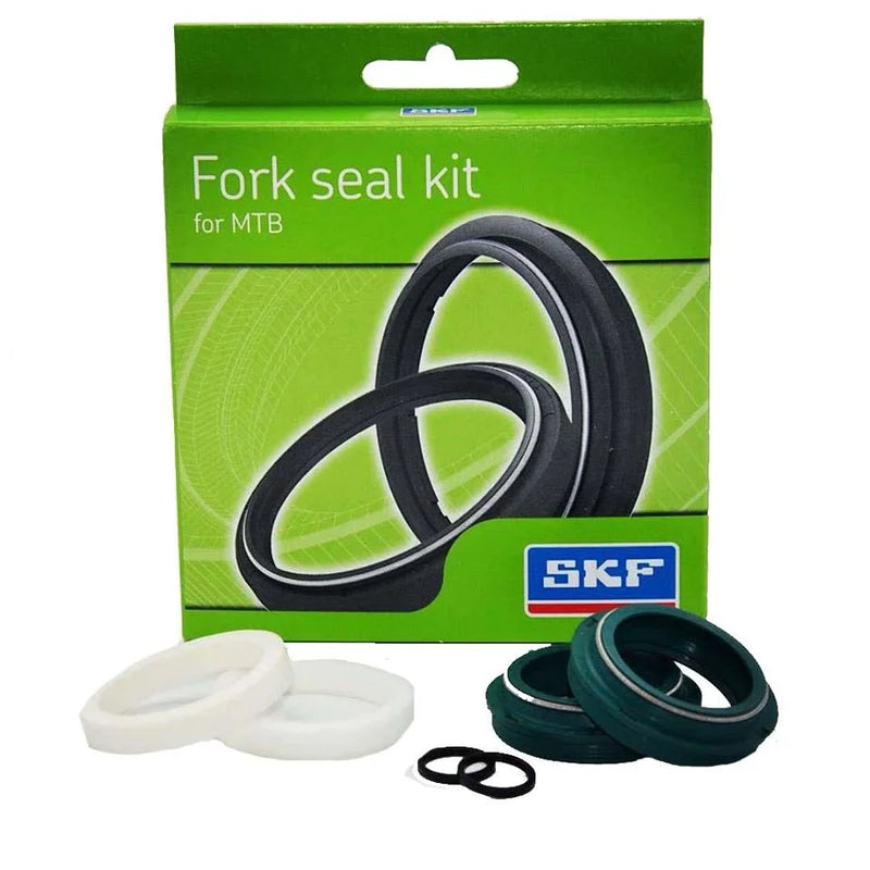 Product image of the fork seal kit in green packaging, with the rings on display in front, against a white background.
