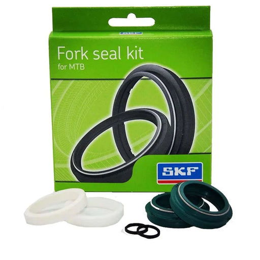 Product image of the fork seal kit in green packaging, with the rings on display in front, against a white background.