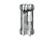 Multitool with multiple tools folded together on a white background