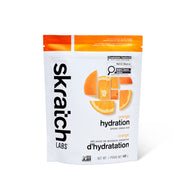 Skratch Labs orange hydration sports drink mix package on a white background