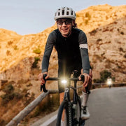 lifestyle image of cyclist with hori 900 bike light in the daytime