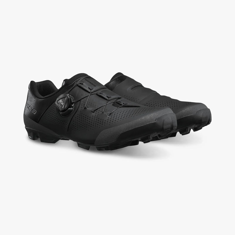 Shimano SH-XC302 pair of cycling shoes in black, three-quarter view