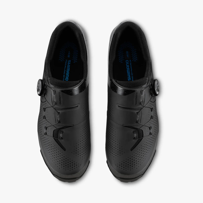 Shimano SH-XC302 pair of cycling shoes in black, top view showing the interior