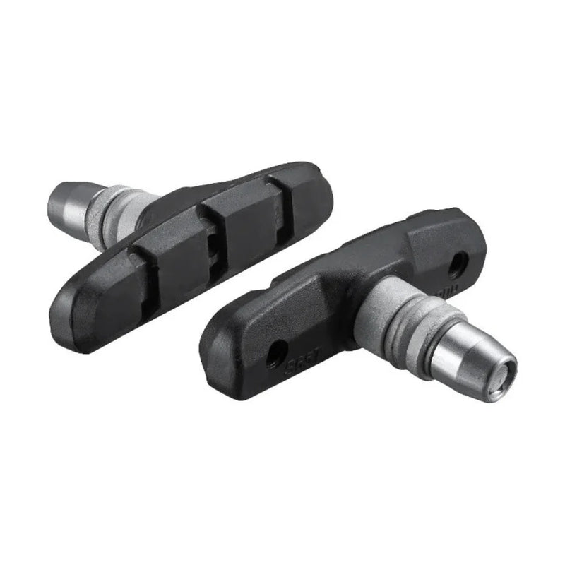 Two bicycle brake pads on a white background