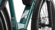 Gazelle Medeo T9 City in Thyme Green Gloss, close-up of top frame tube with 'Medeo' lettering